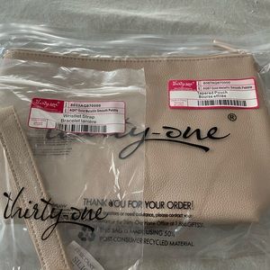 Brand new in bags 31 tapered pouch with wristlet in gold metallic.
